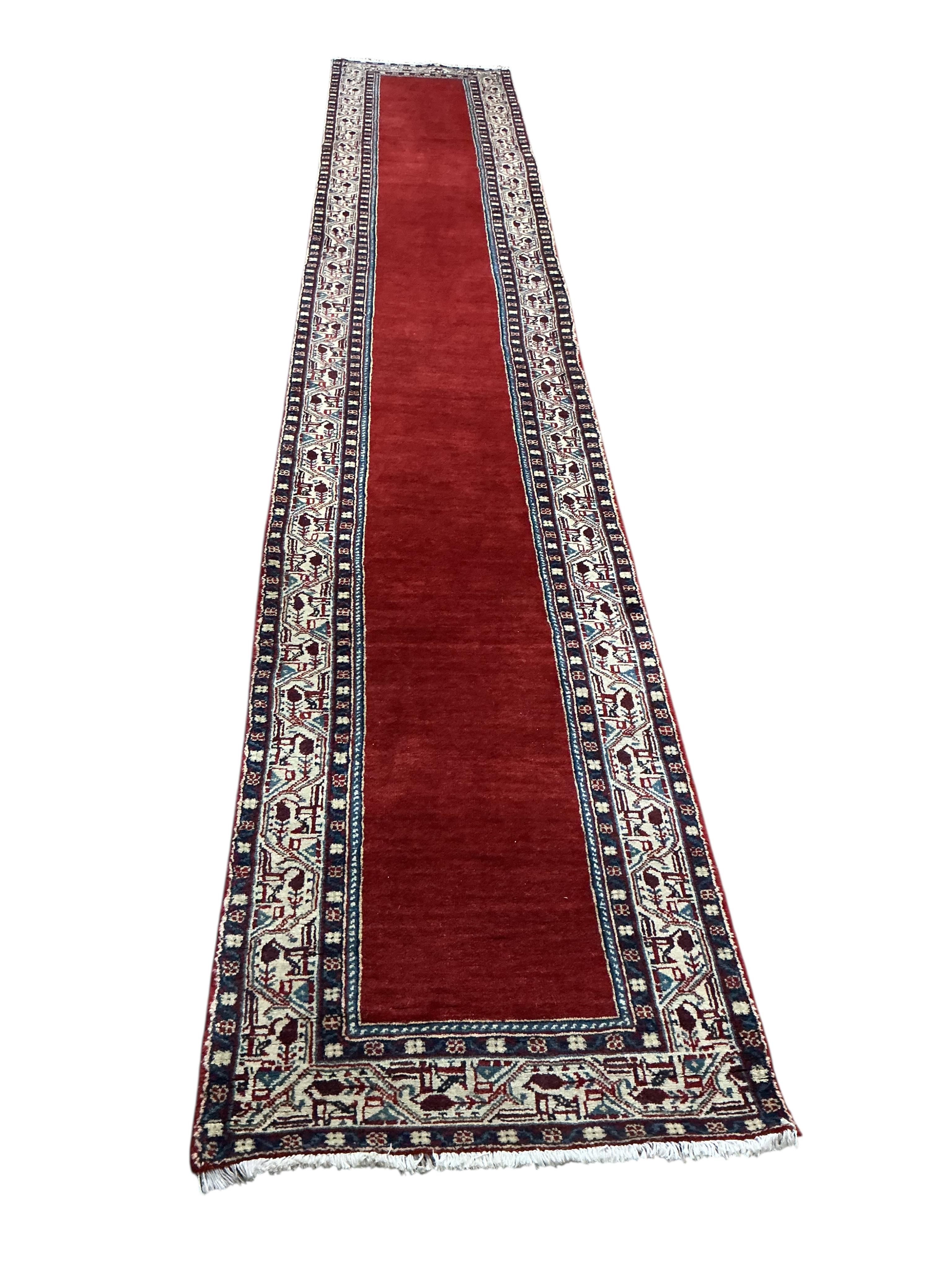 An Araak red ground runner, 440 x 76cm